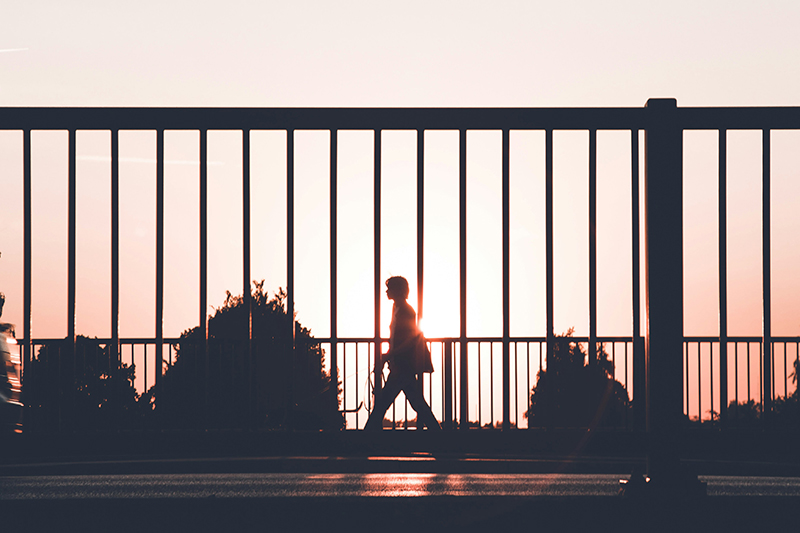 Person walking on street.