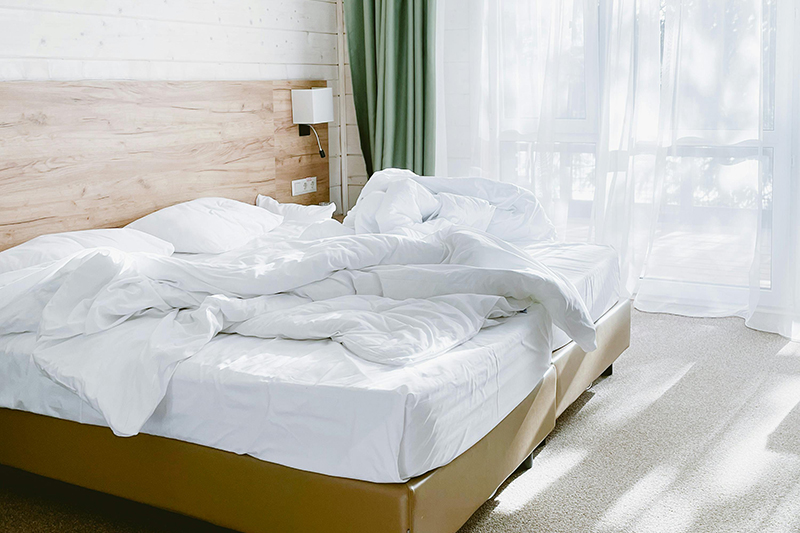 Messy unmade bed.